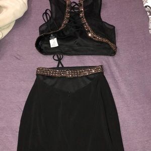 Never worn Faviana two piece black dress